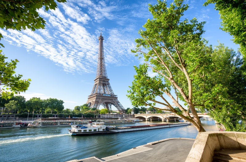 boat cruising down river seine past Eiffel tower