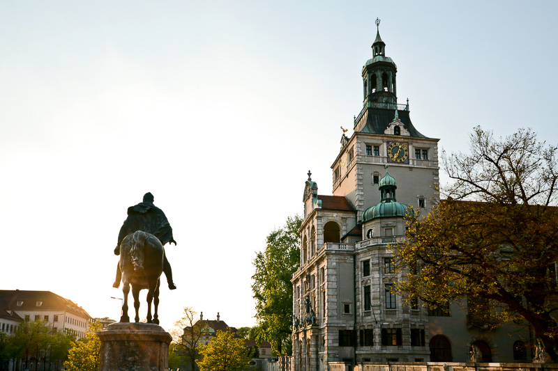 statue of man on a horse in front of Bavarian National Museum building