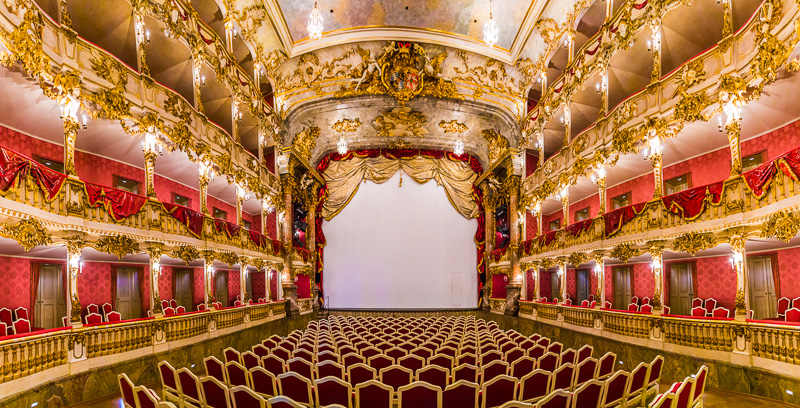 inside famous Munich Residence theater, ornate roofs and red balco ies
