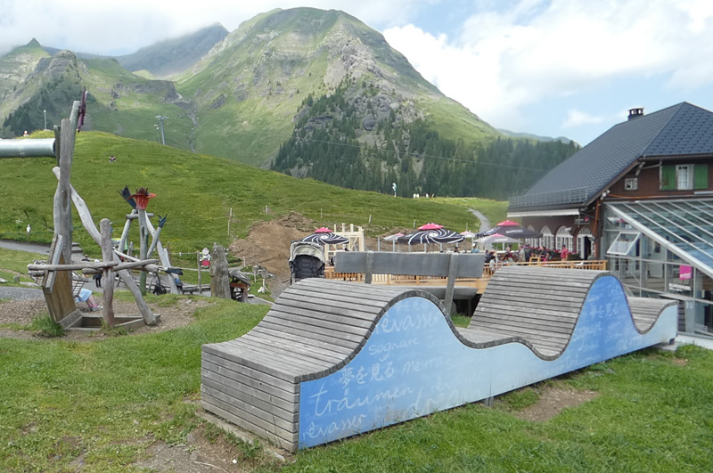 kids playground next to a restaurant with mountain views