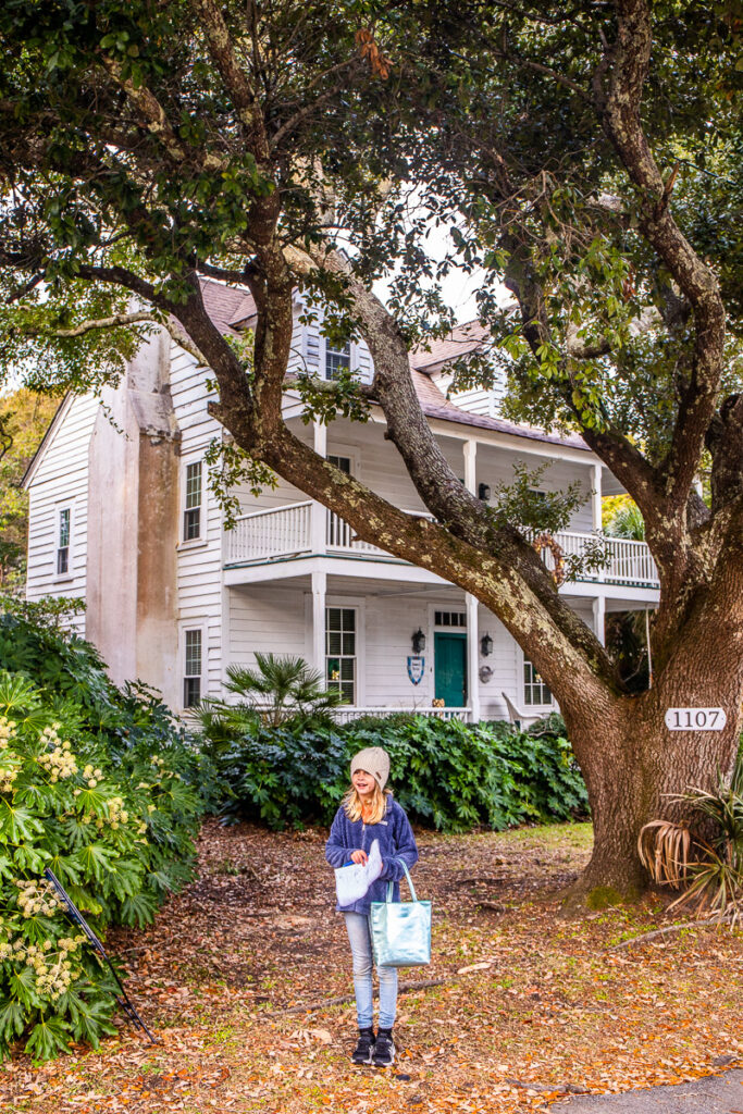 young girl standing in front of blackbeards house