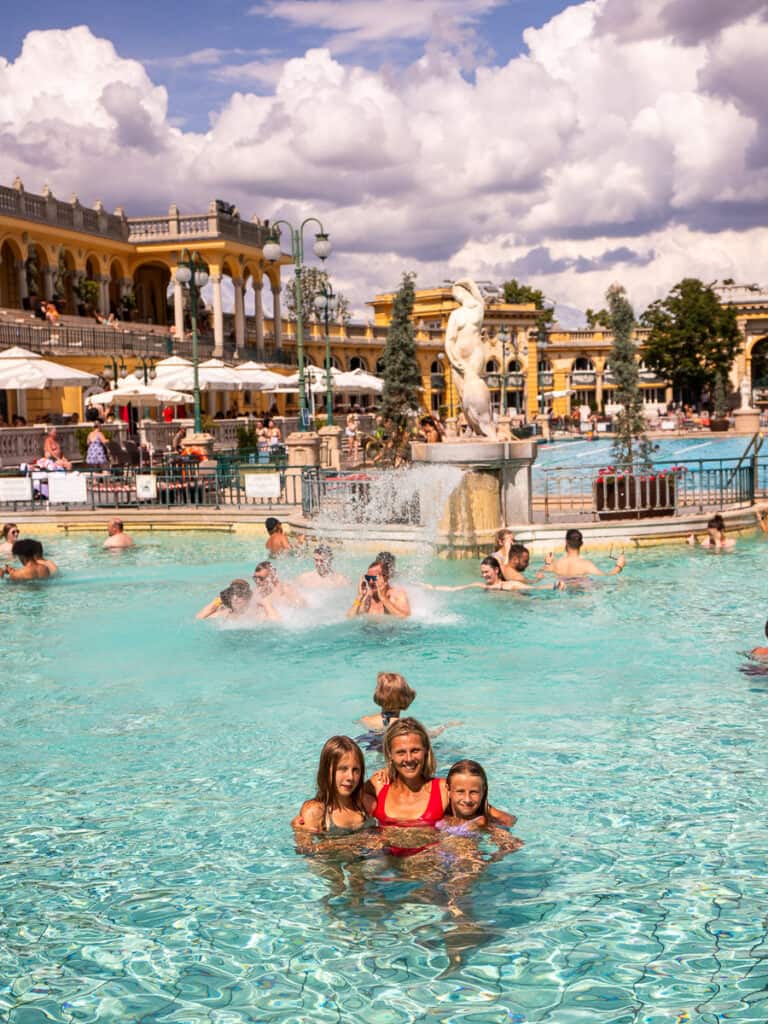 woman and two daughters posing in thermal baths