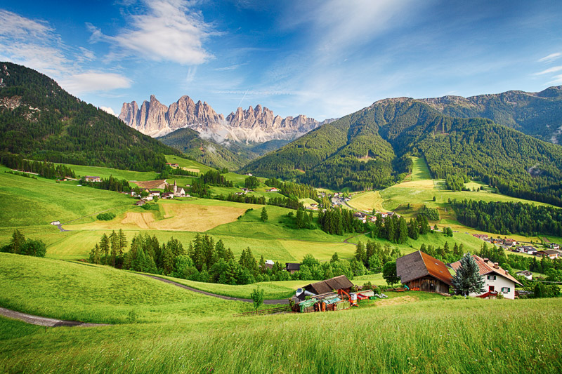 green valley with dolomite peaks in the background