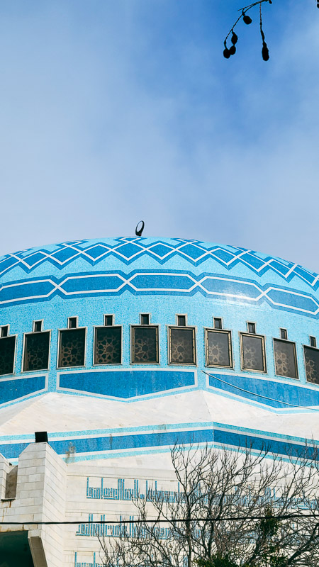 blue domed mosque with intricate designs