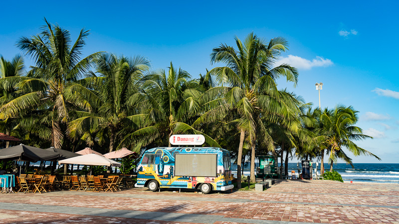 beach dining with colorful combi van