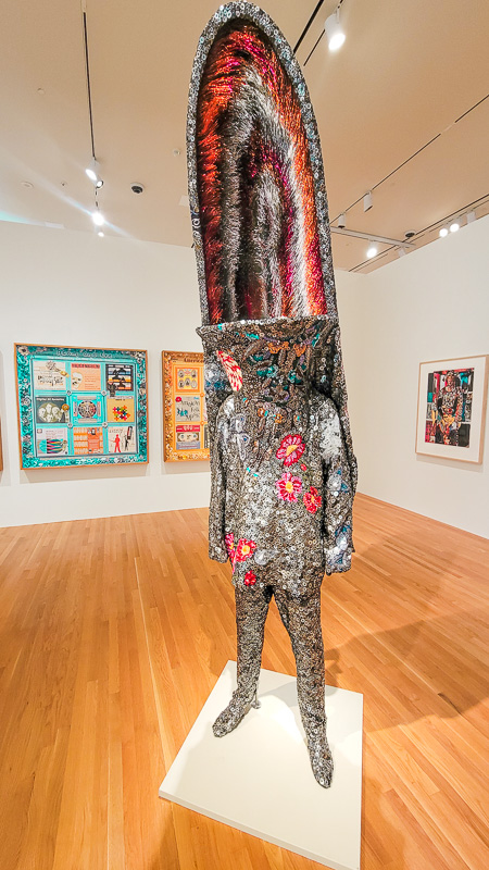 sculpture of glittering coat with sequins