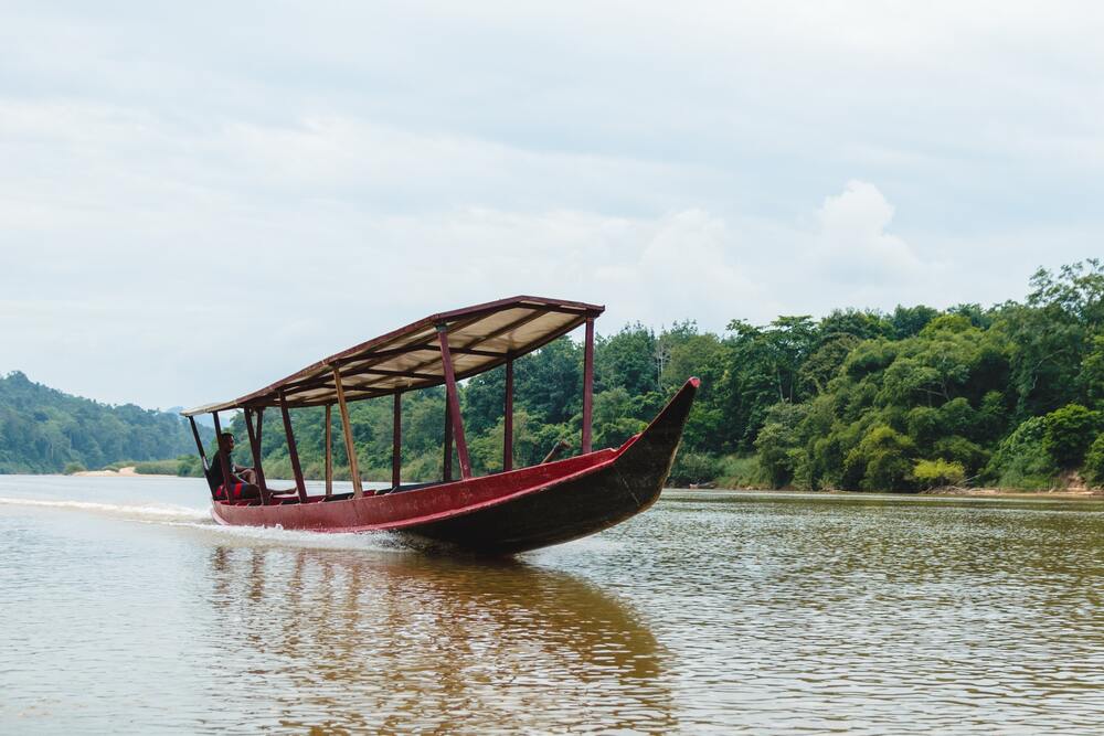 long tail boat on river