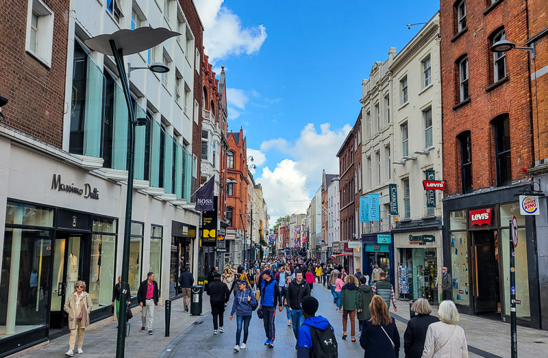 People walking down a street in the city center of Dublin