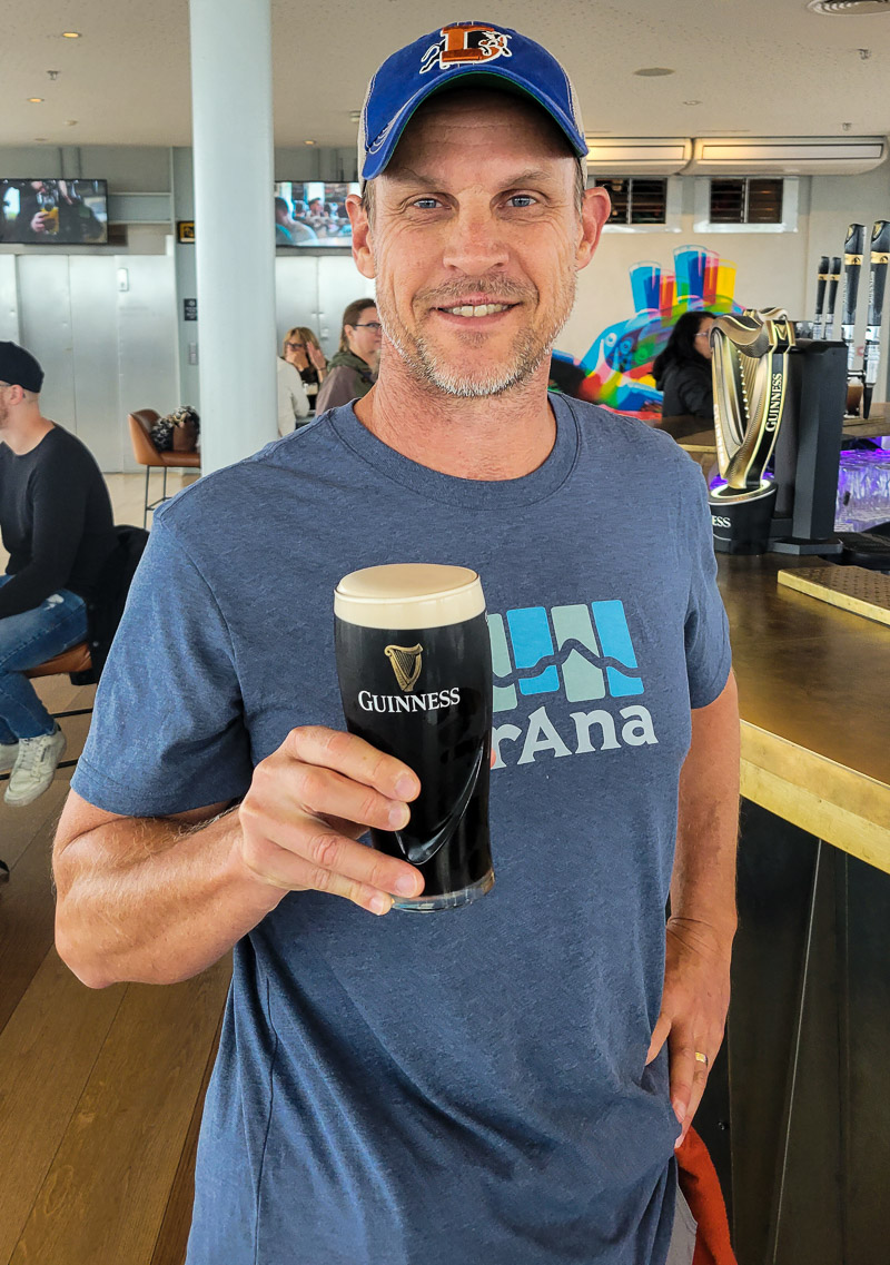 Man drinking a pint of Guinness beer