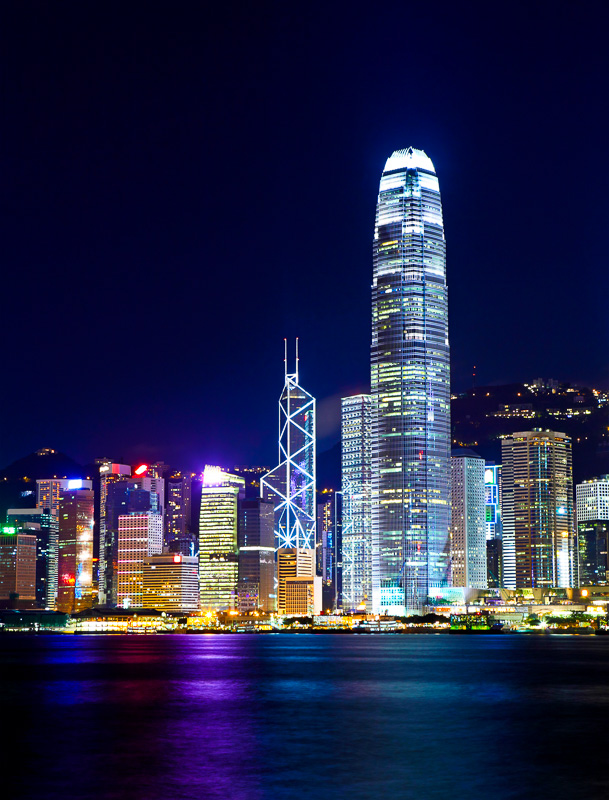 view of hong kong city skyline at night all lit up