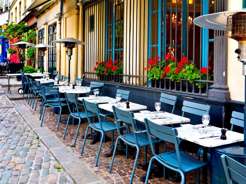 Tables and chairs outside a cafe in Paris