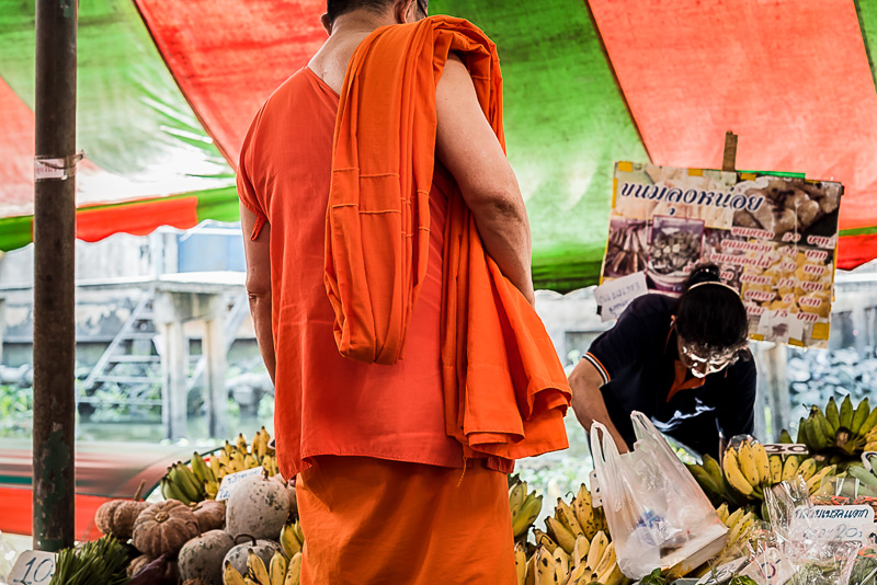 buddhist monk shopping at markets
