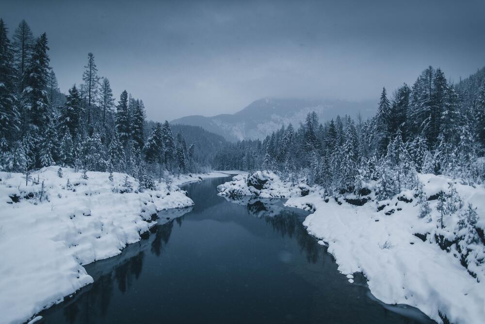 river running through a snowy landscape in Montana
