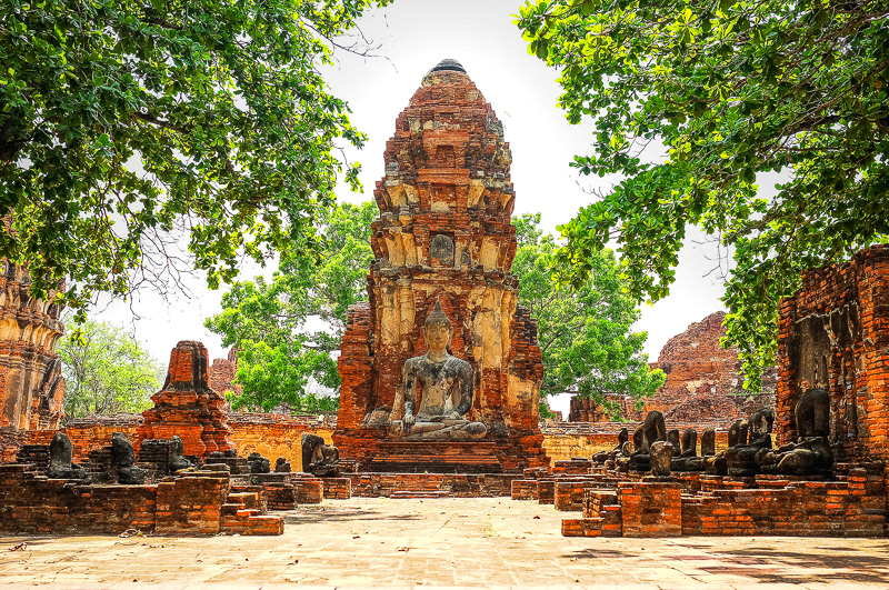 Buddha statue in Wat Mahathat temple, Ayutthaya, Thailand with rows of headless buddhas