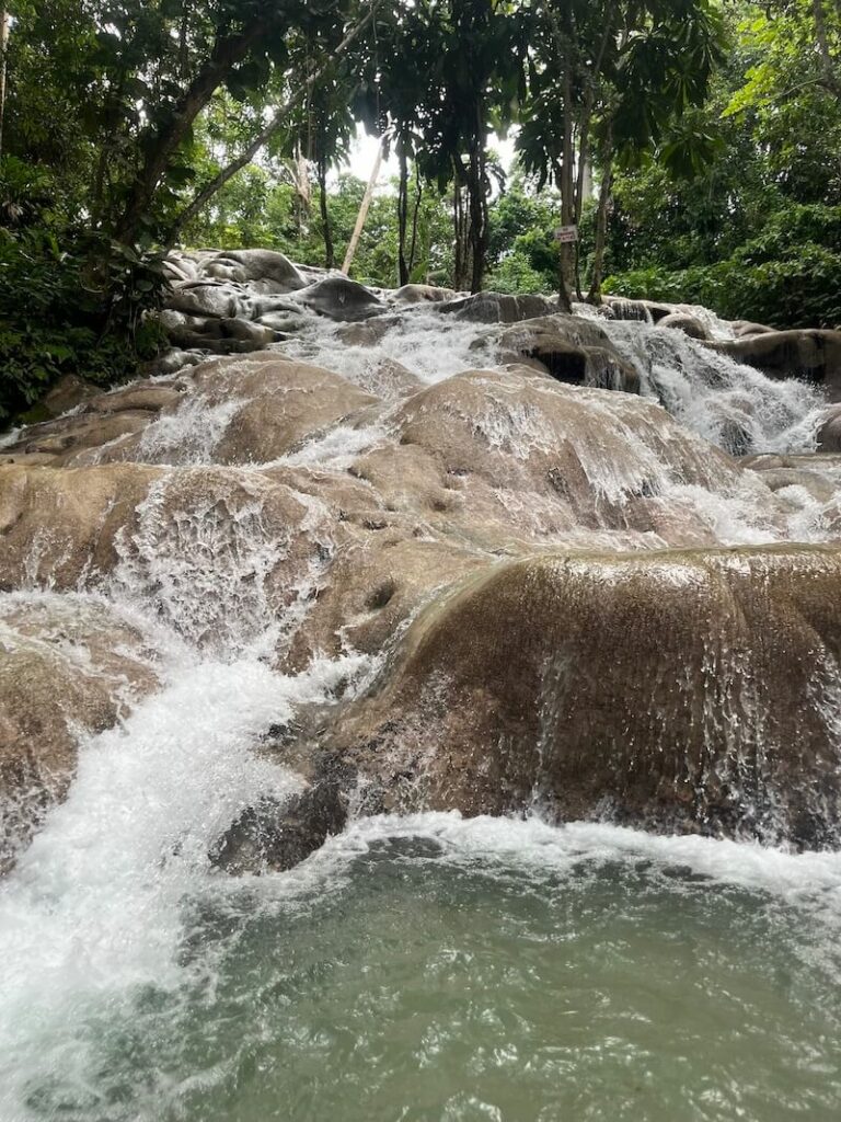 water cascading over rocks at dunn's river jamaica