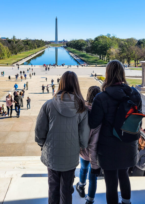 Mom and daughters looking out over the National Mall in DC