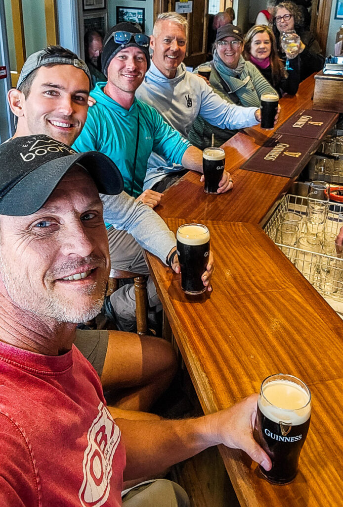 Group of friends enjoying a beer in a pub in Ireland