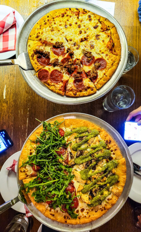 Two pizzas in a restaurant
