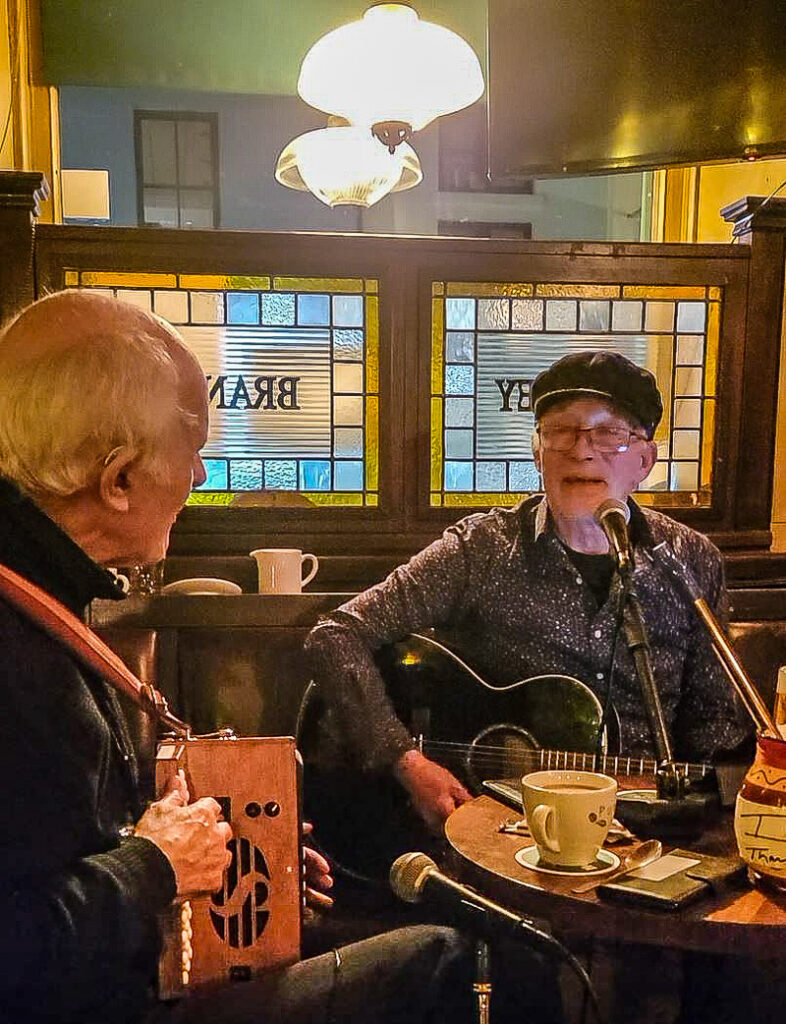 Two musicians playing in a pub
