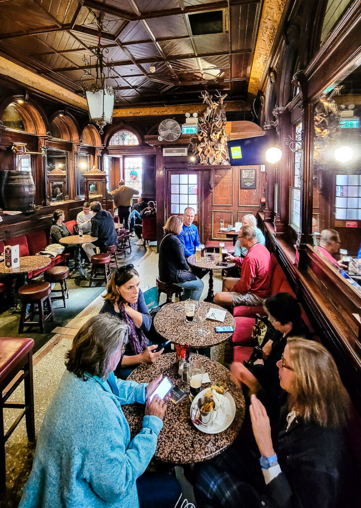 People sitting in a pub drinking and eating