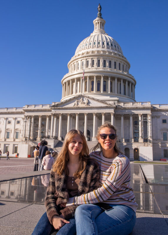 Mon and daughter taking a photo outside the US Capitol Builing in Washington DC