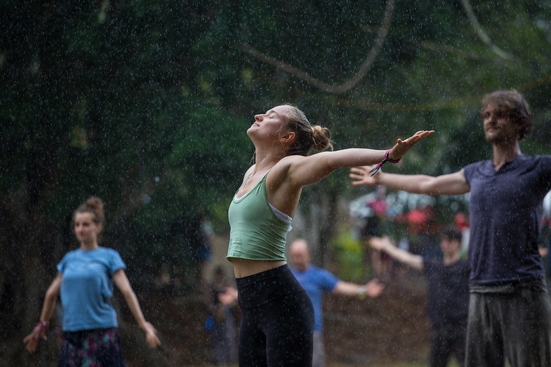 people standing in the rain at woodford folk festival