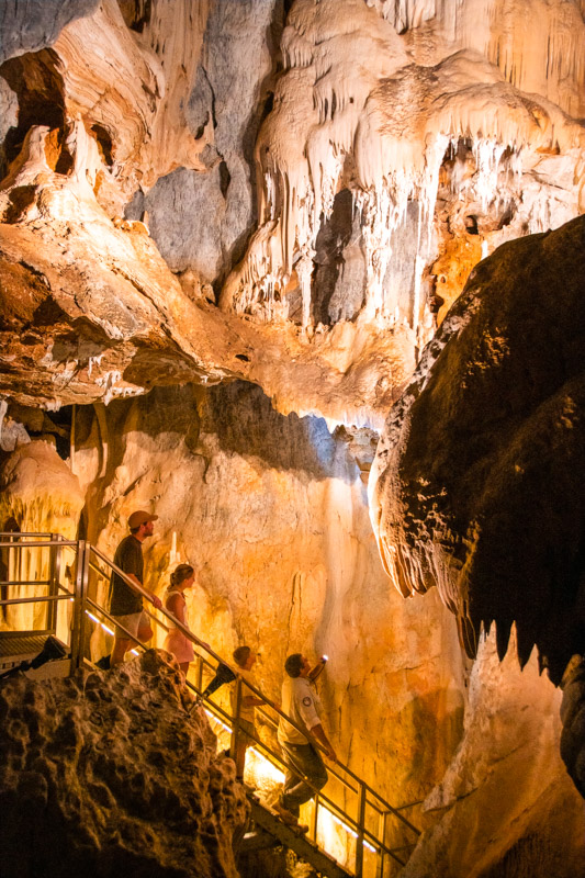 Family exploring a cave on a Ranger-guided Trezkinn Cave Tour