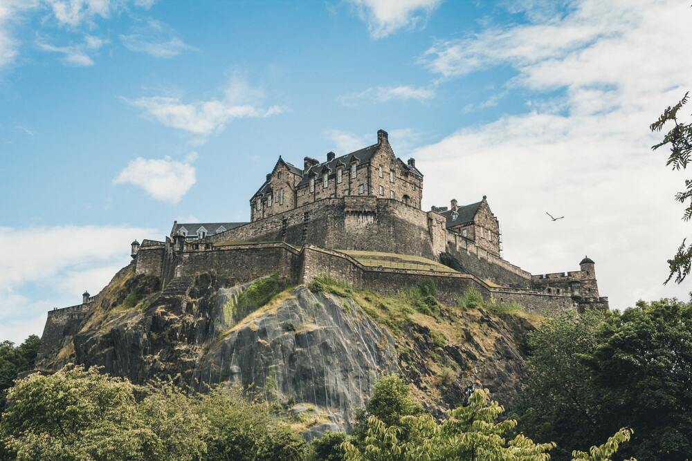 Edinburgh Castle on the hill with wall wrapped around it