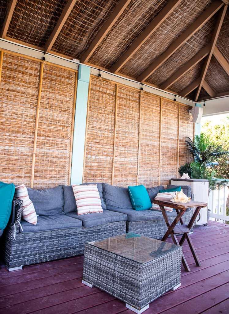 Cane furniture with cushions under a cabana