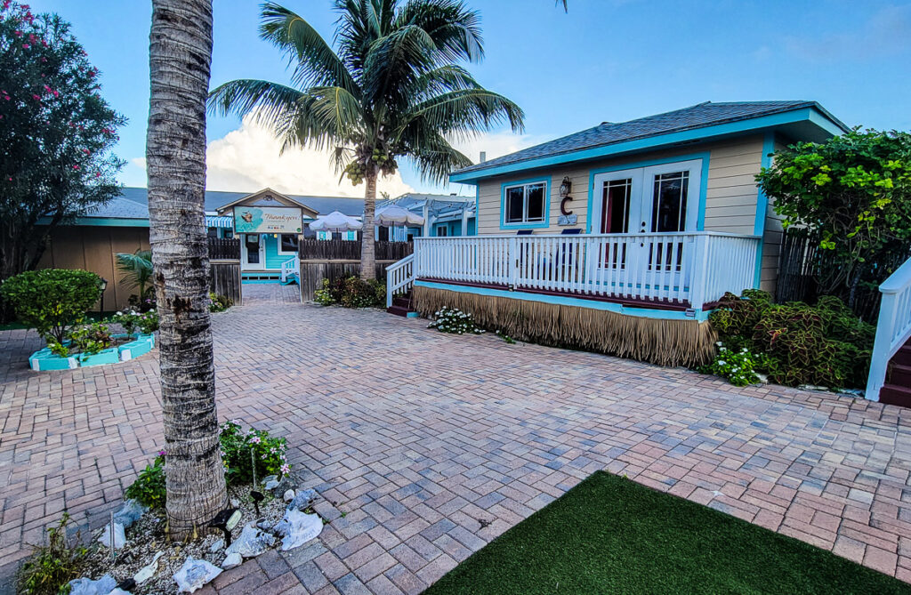 Palm tree and single-story villa at a resort