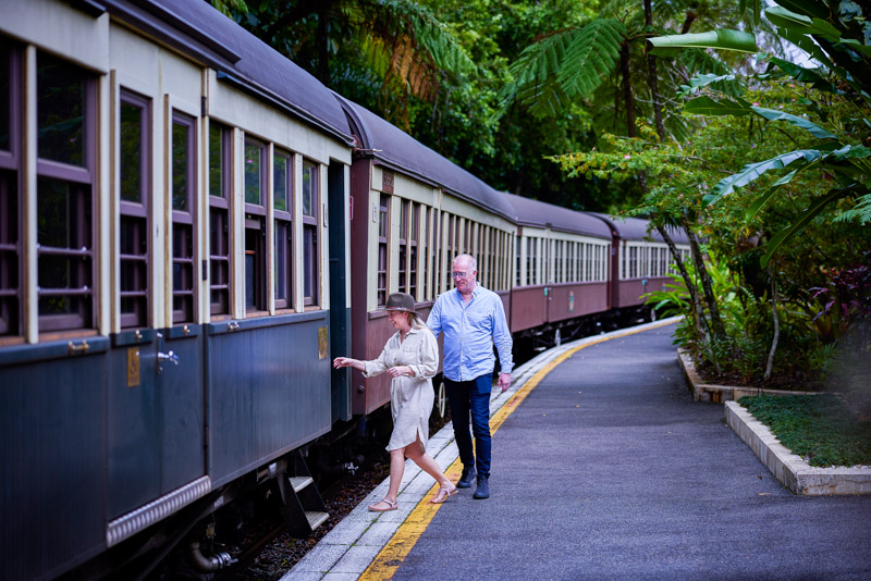 Couple boarding the Kuranda Scenic Railway, while on a Tropic Wings tour