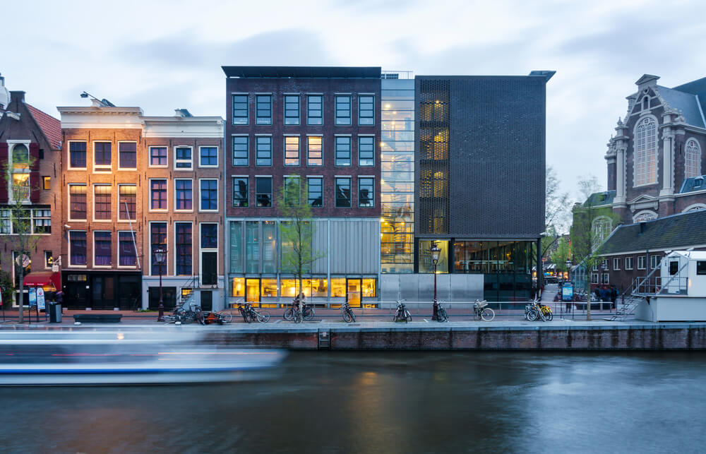 Exterior of anne frank museum on banks of canal