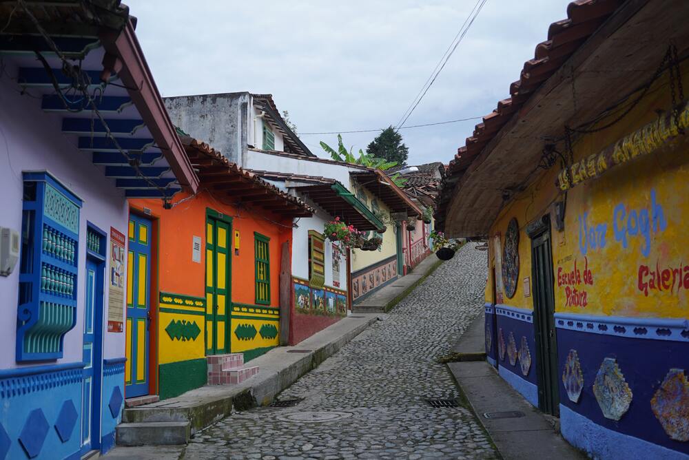 colorful pueblo on cobblestone street in guatape