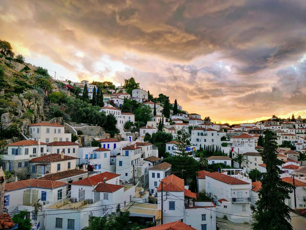 white buildings on the hill in Hydra Greek Islands