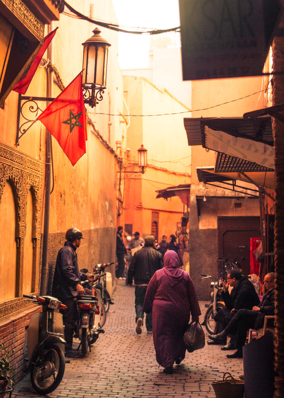 Beautiful light and great atmosphere in one of the many old historical little roads through the souk the nearby bazaar to Djemma El Fna Square.