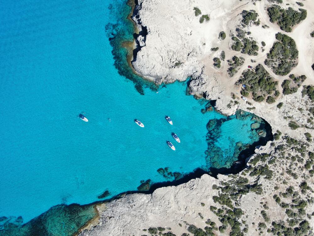 aerial view of boats on blue lagoon