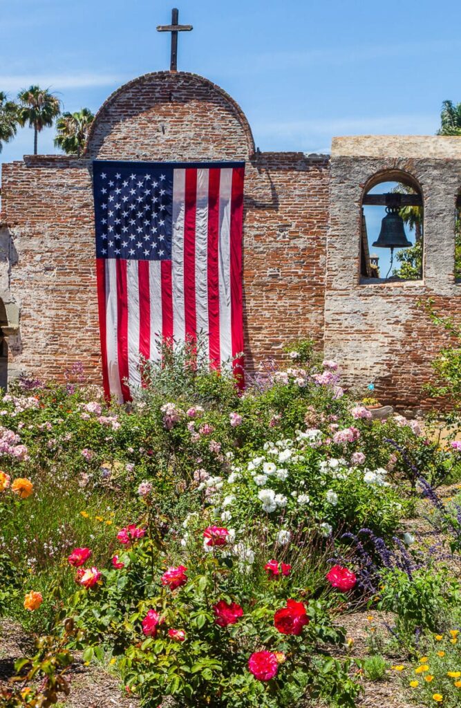 American flag draped over the wall inside a mission