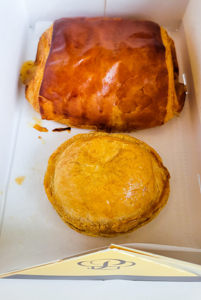 Meat pie and ham and cheese croissant.