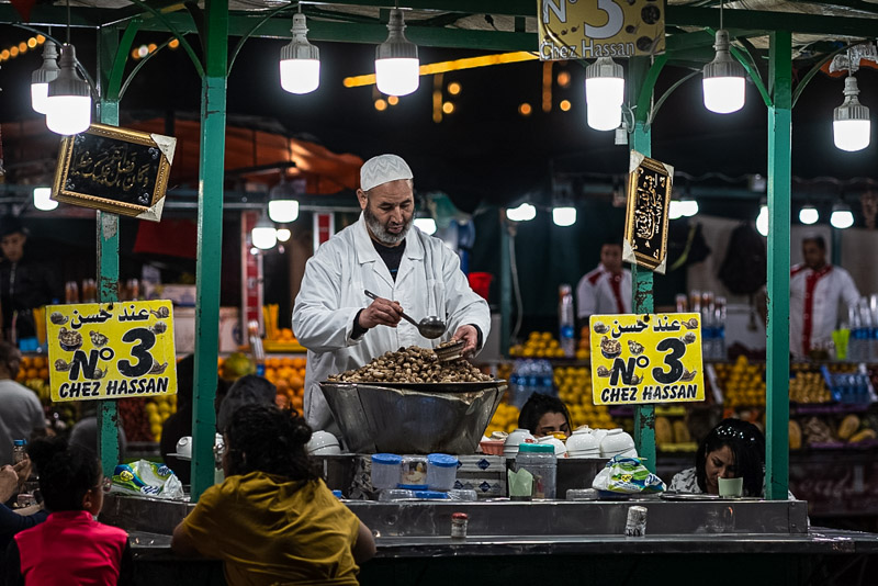  Street food vendor at night in Jemaa el-Fnaa market square.