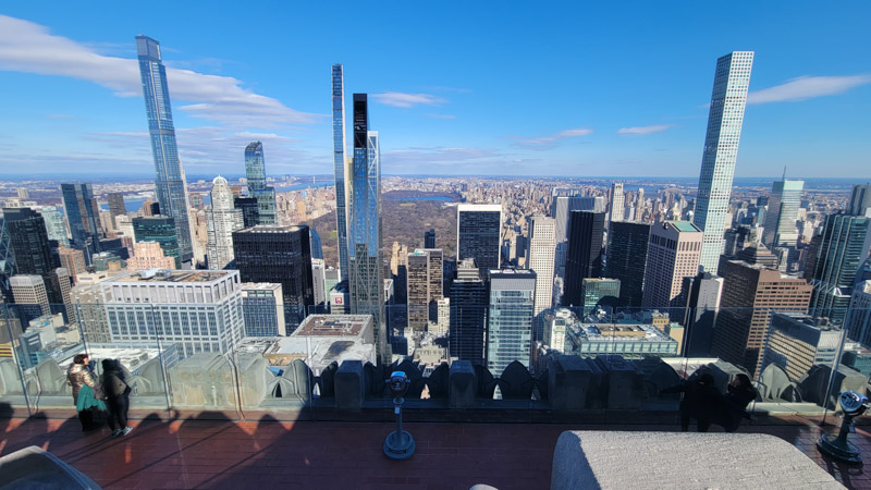 views of central park and buildings at the top of the rock