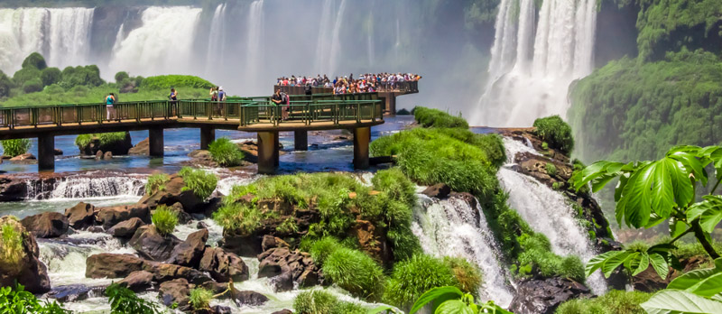 Tourists viewing the waterfalls on the platform in Iguazu National Park
