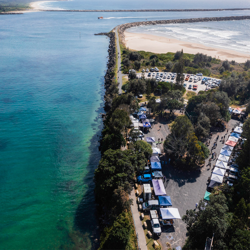 Aerial overlooking the Yamba Farmers and Producers Market on the banks of Clarence River, Yamba.