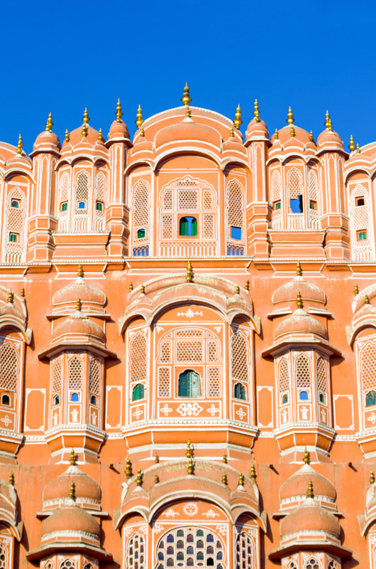 orange exterior of Hawa Mahal palace in Jaipur