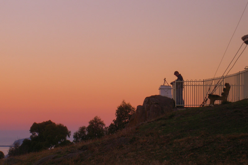 sunset silhouette of person at mt nelson signal station looking at view