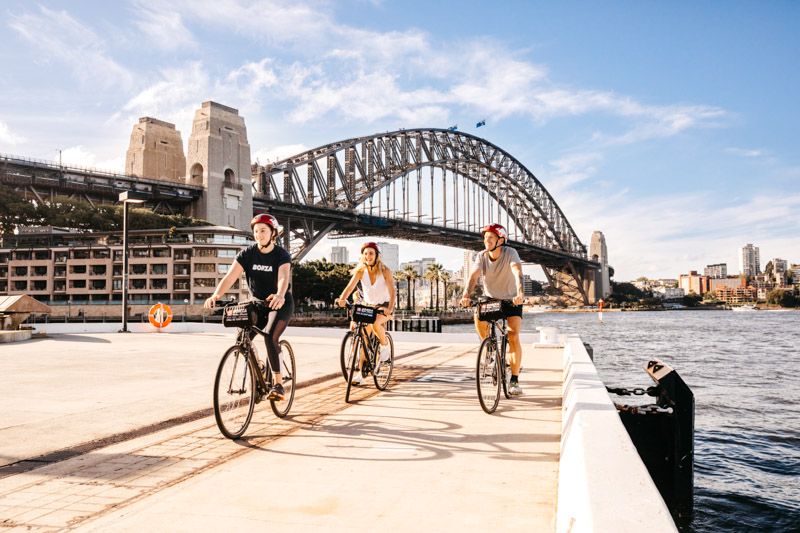 Small group enjoying a ride around Sydney Harbour with Bonza Bike Tours, The Rocks.