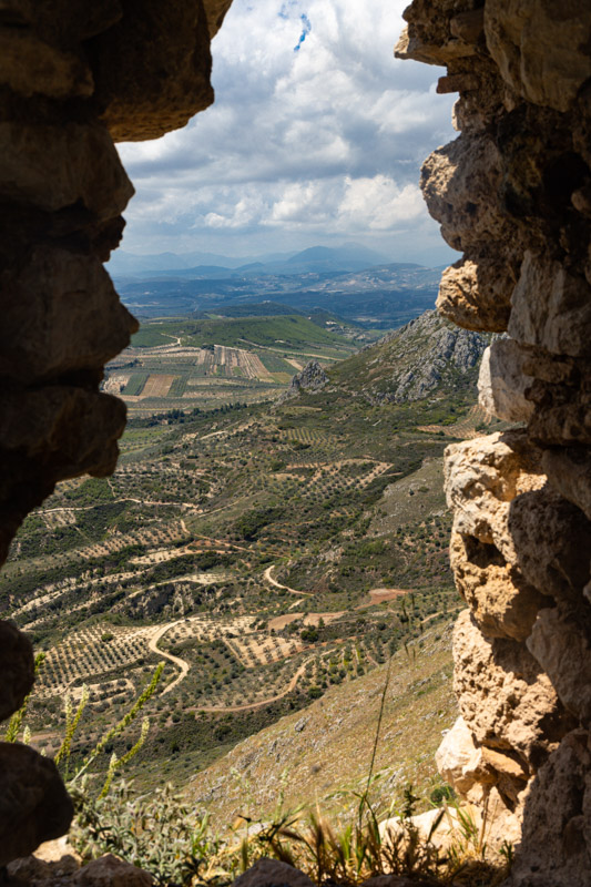 view of valley from hole in fortification wall