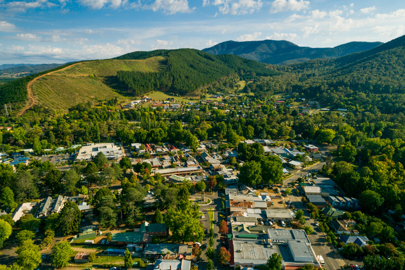 aerial of bright town amongst the mountains