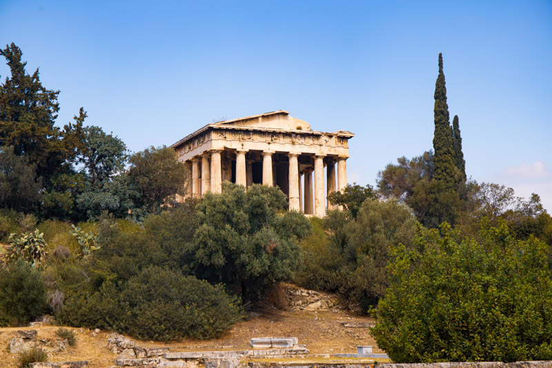  Temple of Hephaestus sitting on hill surrounded by plants