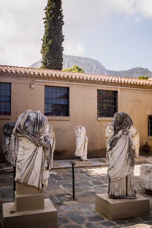 headless statues in the museum at ancient corinth