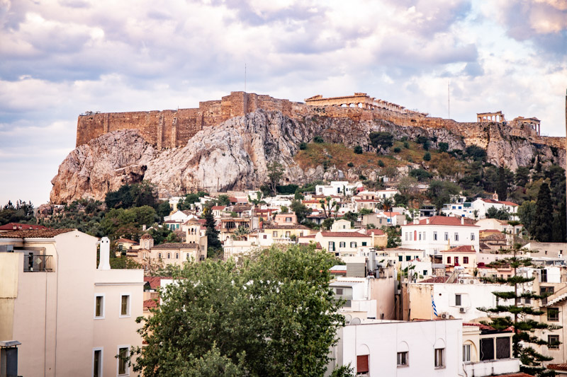 view of acropolis with buildings at the foot of it